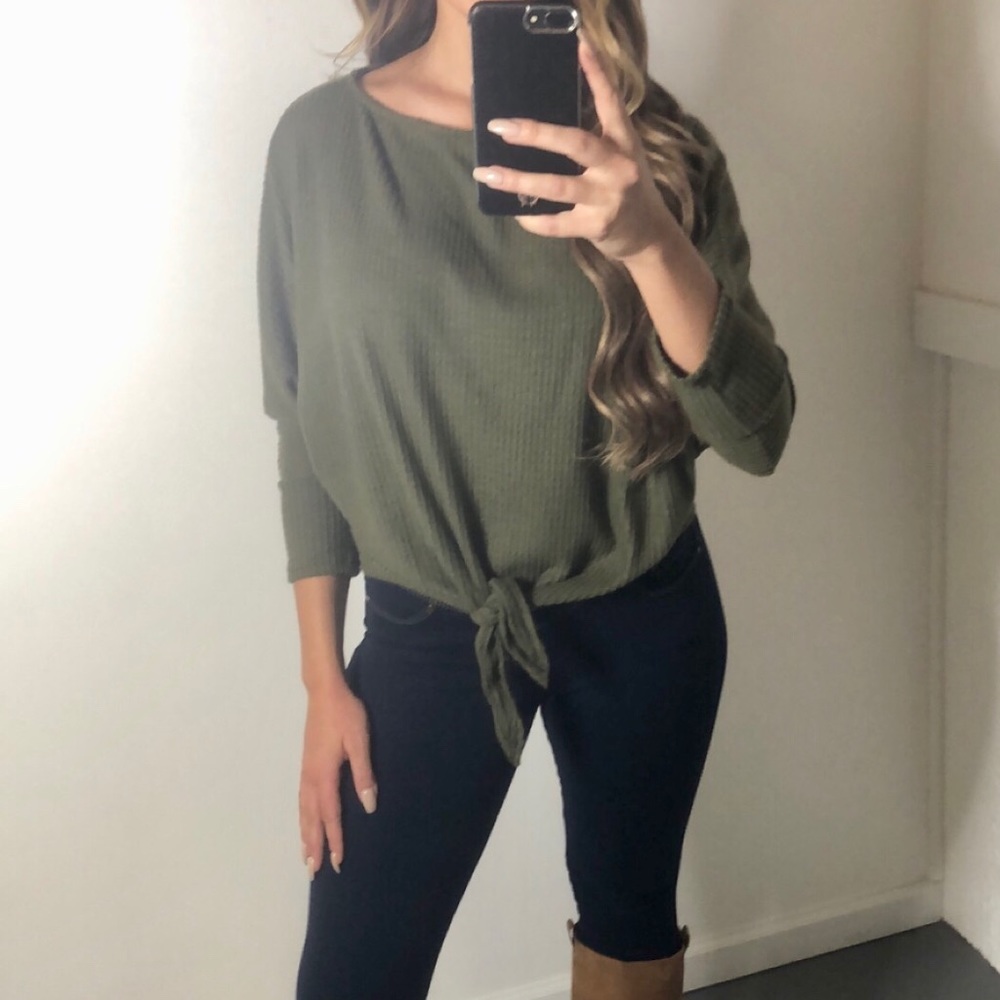 Dolman sleeve solid knit top with a boat neck.